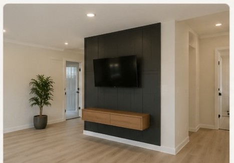 Remodeled living room with accent wall and new flooring