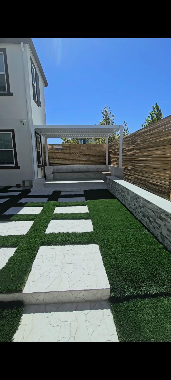 Paver and turf grid with white pergola
